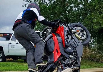 Teach McNeil stunts on a BMW motorcycle.
